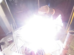 Welding is hard to take pictures of, unless there's a lot of sparks. In which case you have a sparkly picture. This, however, is TIG on aluminum--no sparks, but a lot of light.