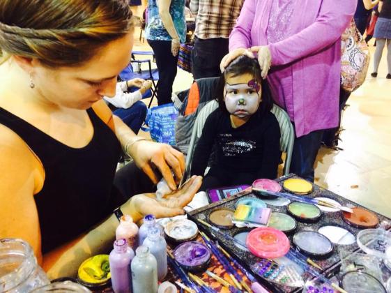 Sarah Glaser face painting Seward Music and Arts Festival Alaska