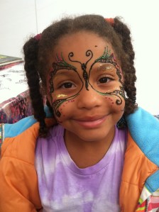 She wanted a henna butterfly on her face. I added glitter.